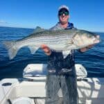 Captain Bobby Rice with topwater striped bass